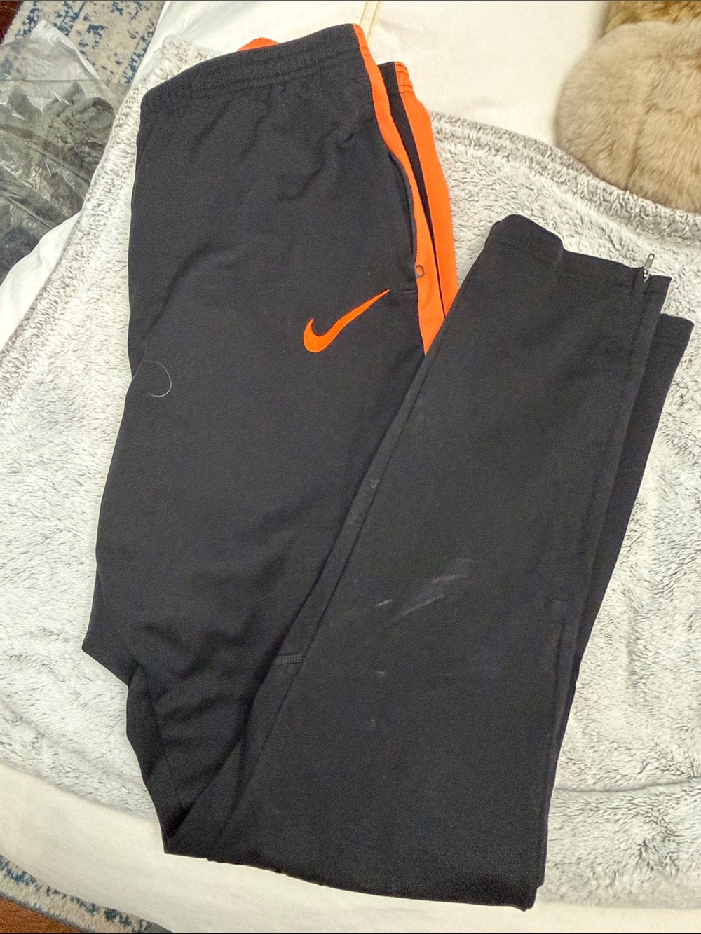 Nike Black Track Pants with Orange Swoosh and Stripe